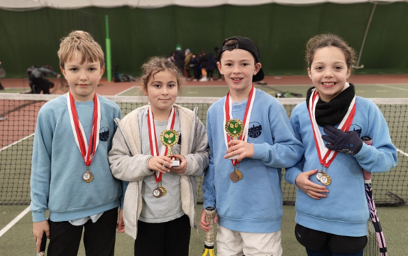 Tetherdown pupils wearing equal access to sport medals