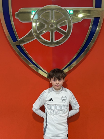 Tetherdown pupil serving as a mascot at the Arsenal vs Manchester United FA cup fixture