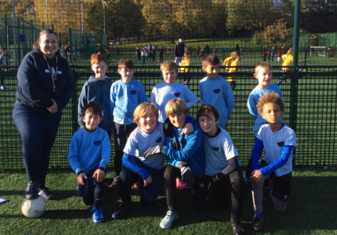 PE coach with Y4 & 6 football team 